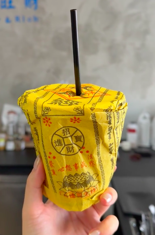 A temple coffee shop’s talisman paper packaging for
